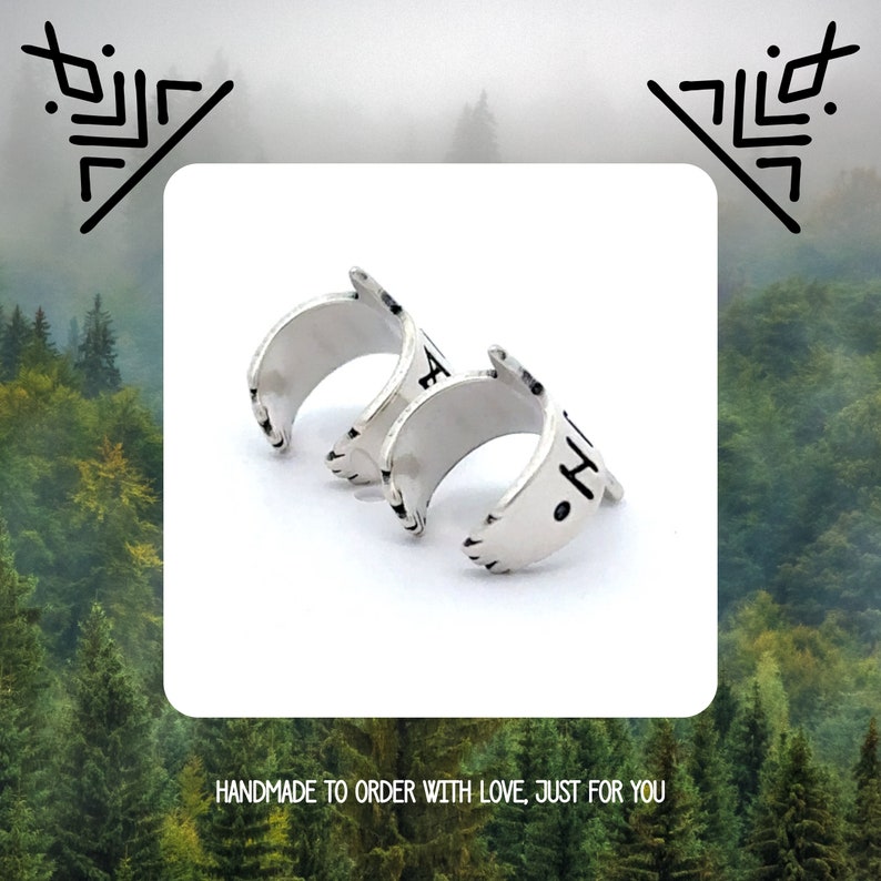 May include: Two silver rings with a textured finish. The rings are stacked on top of each other. The top ring has the word "Faith" inscribed on it. The bottom ring has the word "Hope" inscribed on it. Handmade to order with love, just for you.