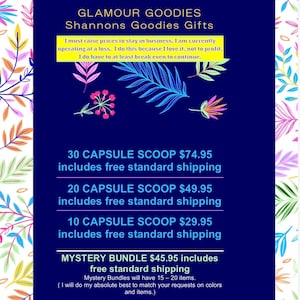 May include: A dark blue informational sign with a colorful botanical border. The text reads: GLAMOUR GOODIES, Shannons Goodies Gifts, I must raise prices to stay in business, 30 CAPSULE SCOOP, 20 CAPSULE SCOOP, 10 CAPSULE SCOOP, and MYSTERY BUNDLE.