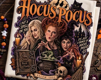 May include: A cream-colored fabric featuring a Hocus Pocus graphic with three witches, a black cat, a spellbook, a cauldron, a skull, and a broomstick. The text reads Hocus Pocus, I Put A Spell On You, It's Just A Bunch Of Hocus Pocus, Book of Spells, Sisters Spells Salem, and Salem 1693.