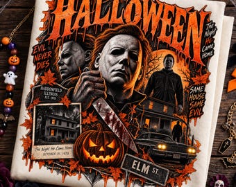 May include: A cream-colored t-shirt featuring a graphic print of the movie Halloween. The design includes Michael Myers, a jack-o'-lantern, a house, a car, and a street sign labeled Elm St. Text reads Halloween, Evil Never Dies, and more.