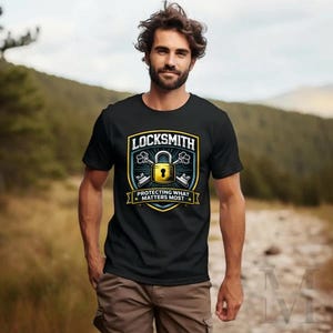 May include: Black t-shirt with a "LOCKSMITH" graphic featuring a gold padlock, keys, and the text "PROTECTING WHAT MATTERS MOST". The design is set on a blue and yellow shield.