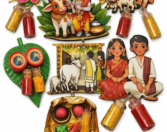 May include: A collection of decorative wooden cutouts featuring illustrations of a deity with a cow, a cow with a calf, a couple, and a scene with a cow, accompanied by small glass vials filled with yellow and red powders and a gold fabric pouch.