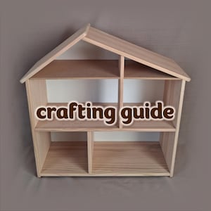May include: A wooden dollhouse with a house-shaped design. The dollhouse has multiple shelves and compartments. The text "crafting guide" is displayed on the front of the dollhouse. The dollhouse is made of light-colored wood.