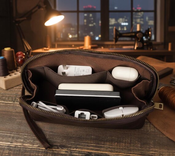 Handcrafted leather tech organizer that actually looks like something a grown adult would carry — not a nylon zipper pouch from a gas station.