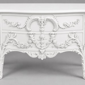 May include: A white wooden chest of drawers featuring two horizontal drawers and an ornate, raised relief carving of floral garlands, scrolls, and acanthus leaves. The piece stands on four curved cabriole legs with detailed feet.