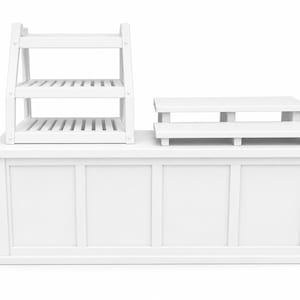 May include: A white wooden retail display set. The set includes a tiered display shelf, a three-tiered display stand, and a large rectangular base with four panels. The display set is designed for showcasing products.
