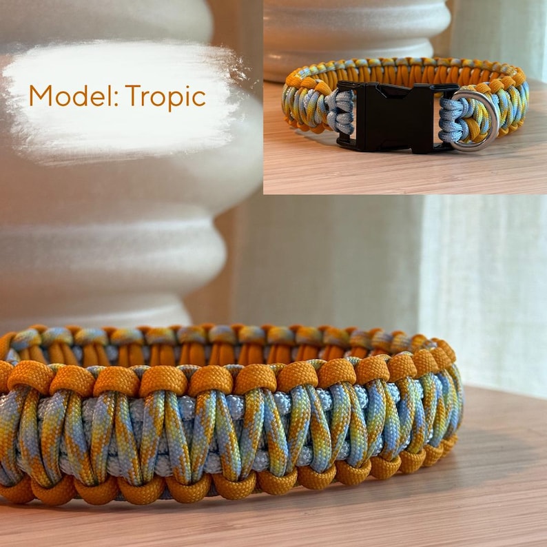 Peut inclure: Un collier tress&eacute; pour chien, mod&egrave;le "Tropic", avec un motif de couleurs jaune, bleu et orange. Le collier est &eacute;quip&eacute; d'une boucle en plastique noir et d'un anneau m&eacute;tallique argent&eacute;. Le texte "Model: Tropic" est visible.