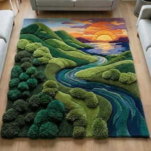 May include: A rectangular tufted rug featuring a landscape design with a winding blue river, rolling green hills, and a textured forest area. The upper section displays a sunset with orange, yellow, and purple clouds reflecting over the water.