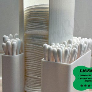 May include: A close-up of white cotton swabs in a white holder, next to a stack of white cotton pads and a roll of white paper towels. The image is in a bathroom setting.