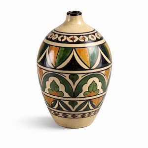 May include: A decorative ceramic vase with a beige base and a black rim. The vase features a repeating pattern of green, orange, and black geometric shapes. The vase is approximately 10 inches tall.