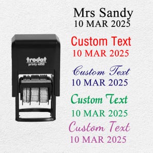 May include: A black Trodat printy 4850 stamp with the text "Mrs Sandy 10 MAR 2025" and four lines of "Custom Text 10 MAR 2025" in red, blue, green, and purple. The stamp is on a white background.
