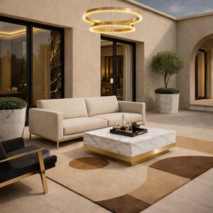 May include: An outdoor patio scene with a beige sofa, marble coffee table with gold trim, and a patterned rug. A black armchair with gold accents is on the left. A circular gold light fixture hangs above the seating area.
