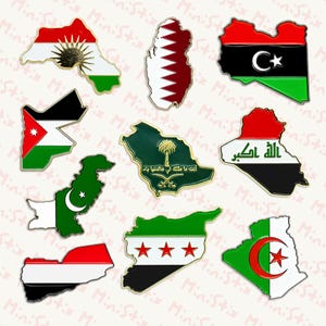 May include: A selection of enamel pins in the shape of country outlines, each displaying a flag design. The pins feature flags from countries such as Iraq, Libya, and Syria. The pins have gold borders and are set against a white backdrop.
