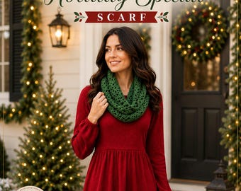 May include: A dark green crocheted infinity scarf with a V-stitch pattern worn over a long-sleeved red dress. The image includes the text COZY V STITCH Holiday Special SCARF and a circular badge with the text EASY BEAUTIFUL FESTIVE HANDMADE WITH LOVE.