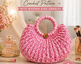 May include: A crochet handbag made from pink and white t-shirt yarn with a round striped handle. The text reads: STRUCTURED T-SHIRT YARN HANDBAG Crochet Pattern WITH WOODEN RING HANDLES. Additional text includes: EASY BEAUTIFUL FUNCTIONAL, BEGINNER FRIENDLY, T-SHIRT YARN, STEP-BY-STEP INSTRUCTIONS, DETAILED PHOTOS, MADE WITH LOVE, CREATE ENJOY GIFT.