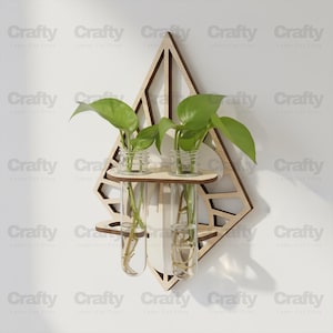 May include: Wooden wall-mounted planter with a geometric design. It features small glass jars and test tubes holding green plants. The word "Crafty" is repeated across the image.