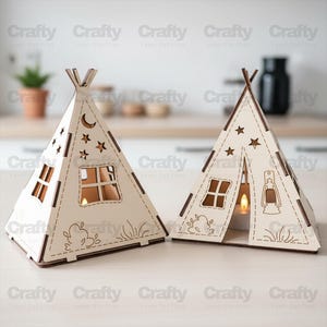 May include: Two light-colored wooden teepee-shaped lanterns with laser-cut designs. The structures feature cutouts of stars, a crescent moon, windows, and a lantern. Each piece has a triangular frame with dark edges and a small tea light inside.