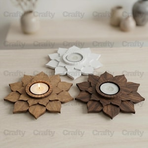May include: Three wooden lotus flower candle holders. One is white, one is light brown, and one is dark brown. Each has a circular center to hold a tea light candle. The light brown candle holder has a lit candle.