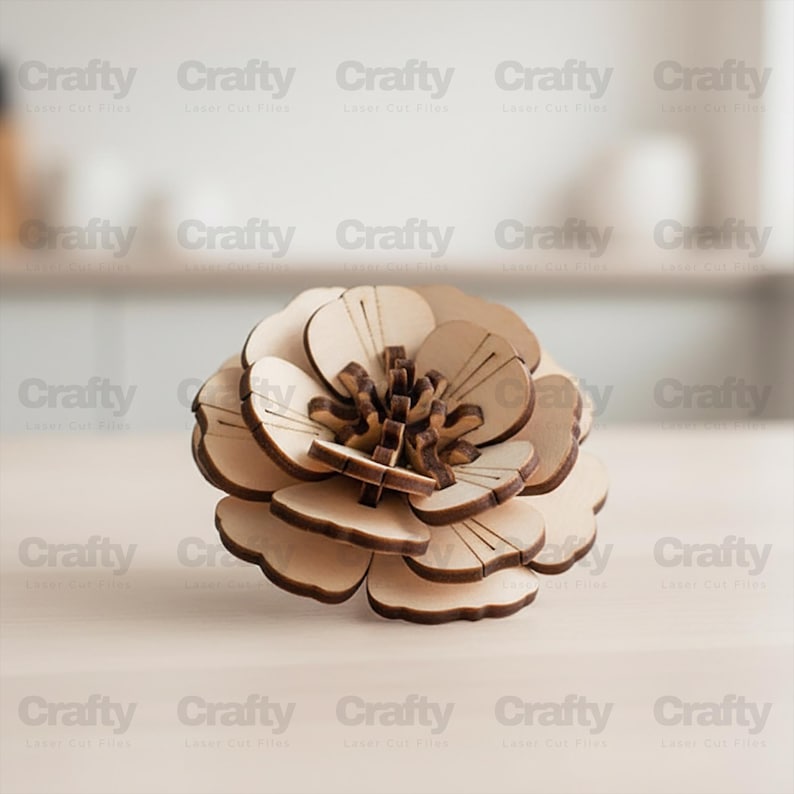 May include: A three-dimensional layered flower sculpture constructed from light-colored wood. The piece features multiple rounded petals with dark, laser-cut edges and a complex, interlocking center structure that creates depth and texture.