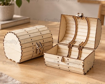 May include: Two light-colored wooden treasure chests with a curved lid design. One chest is closed and features a small latch, while the other is open, revealing a hollow interior with visible slats and a hinged mechanism connecting the lid to the base.