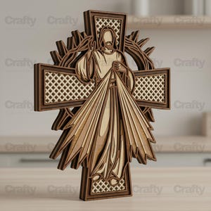 May include: A multi-layered wooden wall art piece depicting the Divine Mercy of Jesus. The design features a central figure with rays emanating from the chest, set against a cross with a lattice pattern and a surrounding crown of thorns motif.