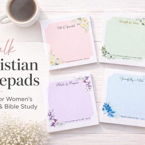 May include: A selection of pastel-coloured Christian notepads, each adorned with floral designs and inspirational quotes. These notepads are intended for ministry and Bible study, featuring phrases such as "Still & Grateful" and "Strength for Today."