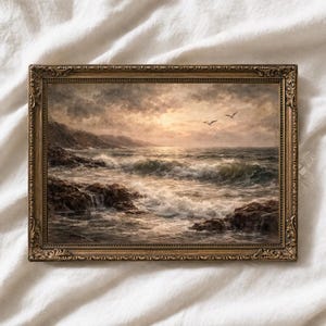 May include: An antique-style framed painting depicts a dramatic seascape. The artwork showcases crashing waves, rocky shores, and a cloudy sky with a hint of sunlight. Two birds fly above the water, adding a sense of movement.