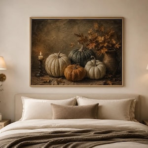May include: A rectangular wall art print featuring a still life painting of four pumpkins in shades of white, green, and orange, a lit candle in a dark holder, and a ceramic pitcher filled with dried autumn leaves, all set against a dark background.