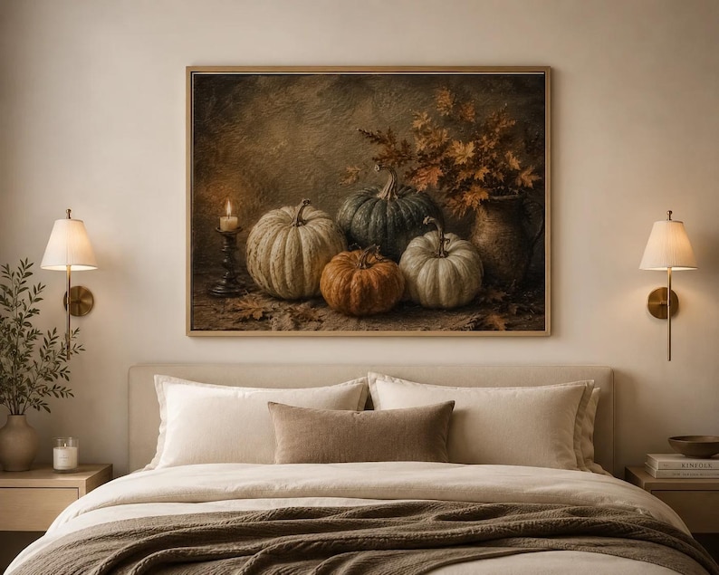 May include: A rectangular wall art print featuring a still life painting of four pumpkins in shades of white, green, and orange, a lit candle in a dark holder, and a ceramic pitcher filled with dried autumn leaves, all set against a dark background.