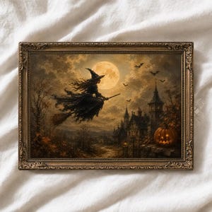 May include: A rectangular wall art piece in an ornate bronze-coloured frame featuring a painting of a witch flying on a broomstick against a large full moon. The scene includes a dark gothic building, flying bats, and a glowing jack-o'-lantern.