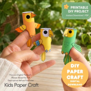 May include: Three paper finger puppets shaped like birds in orange, yellow, and green. Each puppet features a cylindrical body, a beak, and wings. Text on the image reads: PRINTABLE DIY PROJECT Instant Download | PDF and DIY PAPER CRAFT.