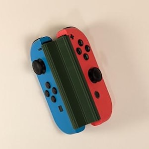 May include: A white ceramic mug with a black handle and the text "But First, Coffee" in a bold, black font. The mug is sitting on a wooden surface. The mug appears to be 12 ounces.