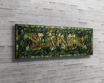 May include: A rectangular wall sign featuring a stained glass effect with a green and gold color palette. The design includes a dark green Celtic knot border and shamrock motifs surrounding the gold-colored text that reads SLAINTE!