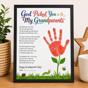 May include: A framed print featuring the text God Picked You to Be My Grandparents, a poem, and a red handprint shaped like a flower. The design includes a green stem, leaves, grass, a ladybug, a caterpillar, and a bee on a white background.