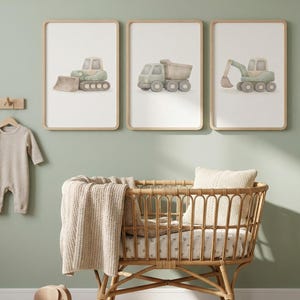 Könnte beinhalten: Set aus drei Keramikbechern mit gesprenkelter, matter Oberfläche. Die Becher sind in Creme-, Hellgrau- und Dunkelgrautönen gehalten. Jede Tasse hat ein schlichtes, minimalistisches Design.