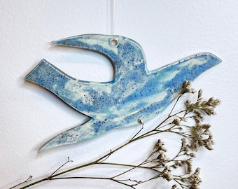 Hand made ceramic hanging bird decoration, hand glazed with glazes in shades of blue