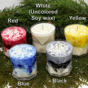 May include: Five soy wax candles in clear glass containers, each with a wick and decorative wax chips. Colors include red, white, yellow, blue, and black. The text on the image reads: White (Uncolored Soy wax).