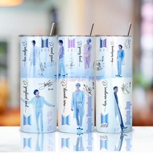 May include: A set of six stainless steel tumblers with images of the musical group BTS. Each tumbler features a different member, their signature, and the BTS logo. The background is a gradient of light blue and white.