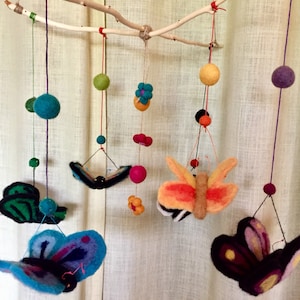 Wool hand needle felted butterfly mobile on wooden branch