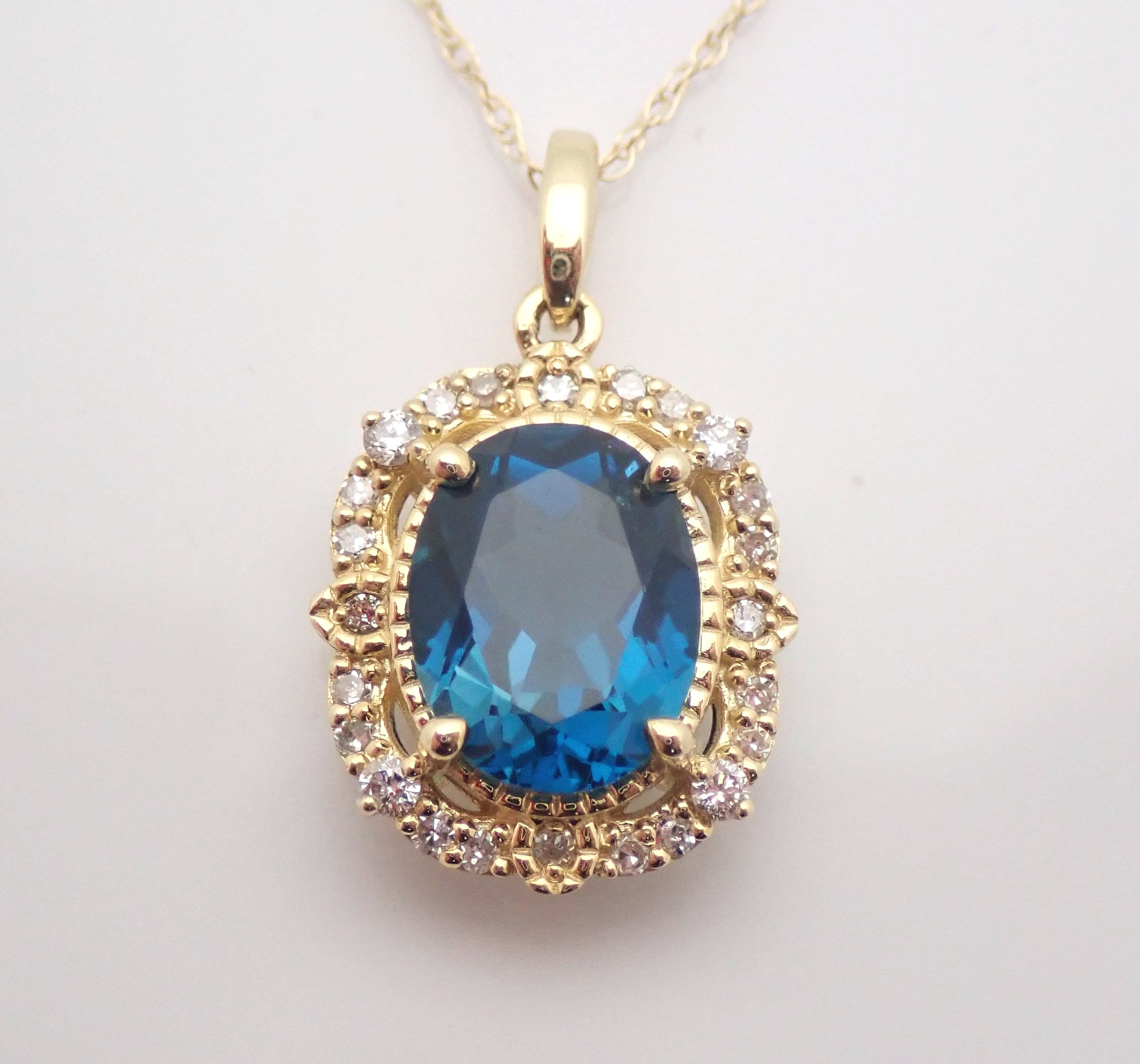 Yellow Gold London Blue Topaz and Diamond Halo Pendant Necklace 18 Chain