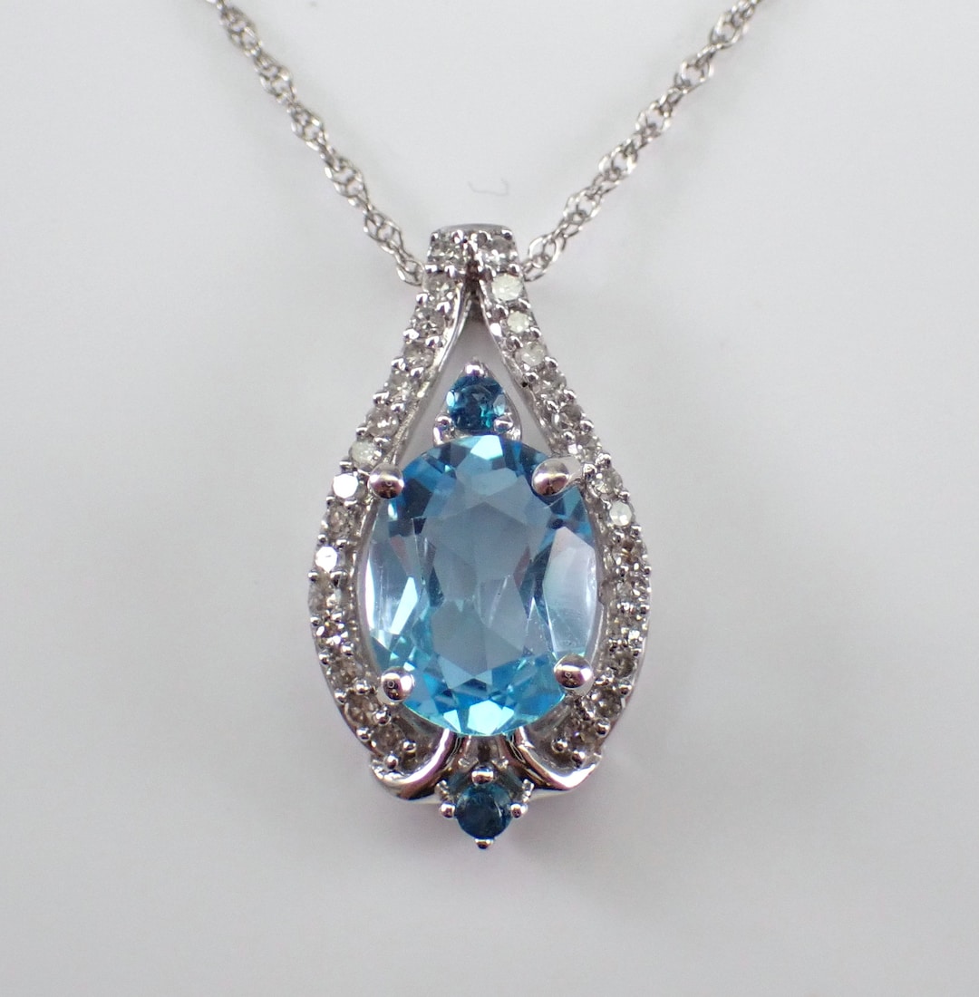 A Diamond and Blue Topaz pendant
