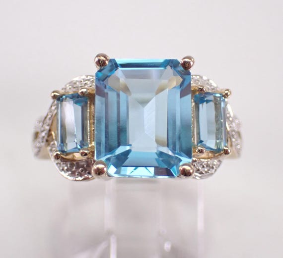 Yellow Gold Blue Topaz and Diamond Ring: Three Stone Gemstone Engagement Setting
