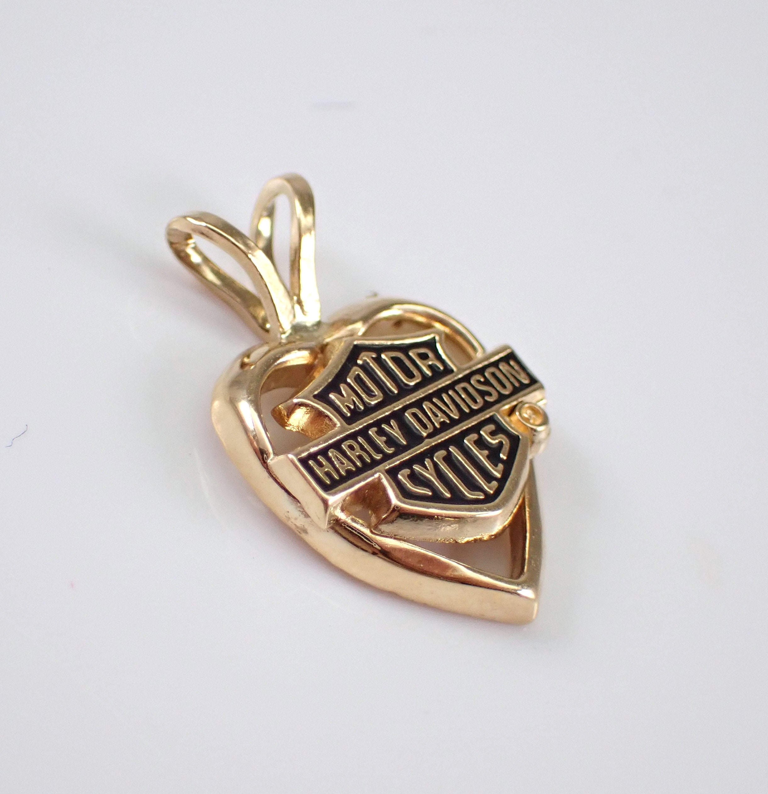 Gold harley hotsell davidson pendant