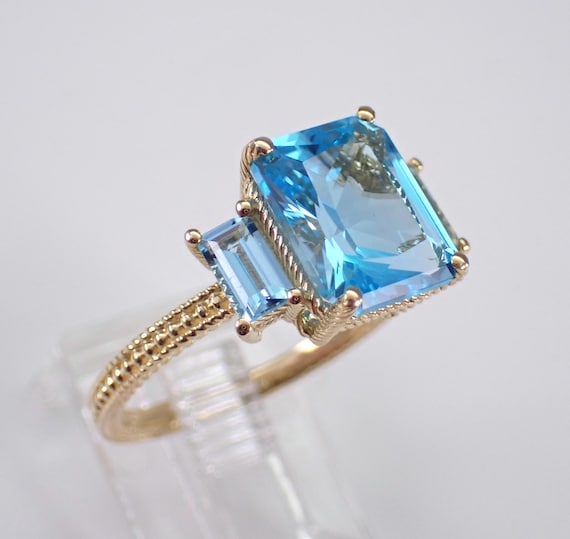 14K Yellow Gold Blue Topaz Ring: Three Stone Gemstone Engagement Setting
