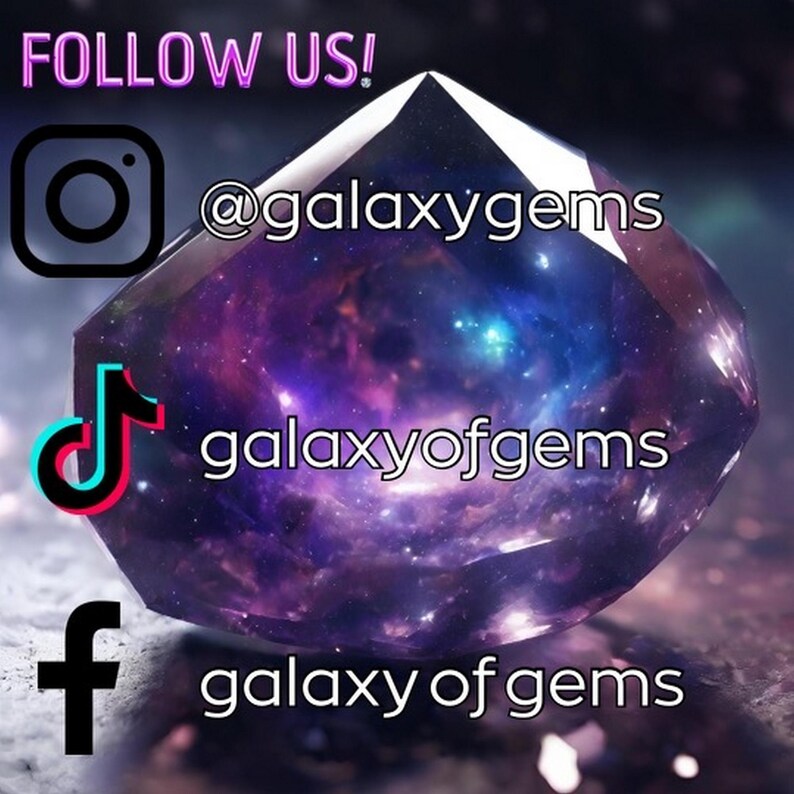 May include: Image promoting social media accounts. A large, faceted gem with a galaxy design is the focal point. The text "FOLLOW US!" is above the Instagram logo and handle "@galaxygems". The TikTok and Facebook handles are "galaxyofgems".