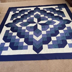 May include: A set of three ceramic mugs with a speckled, matte finish. The mugs are in shades of cream, light gray, and dark gray. Each mug has a simple, minimalist design, perfect for coffee or tea.