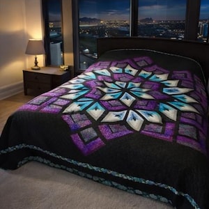 May include: A black bedspread with a geometric design in shades of purple, teal, and white. The quilt features a central starburst pattern and a decorative border. The bedspread is on a bed in a room with a city view.