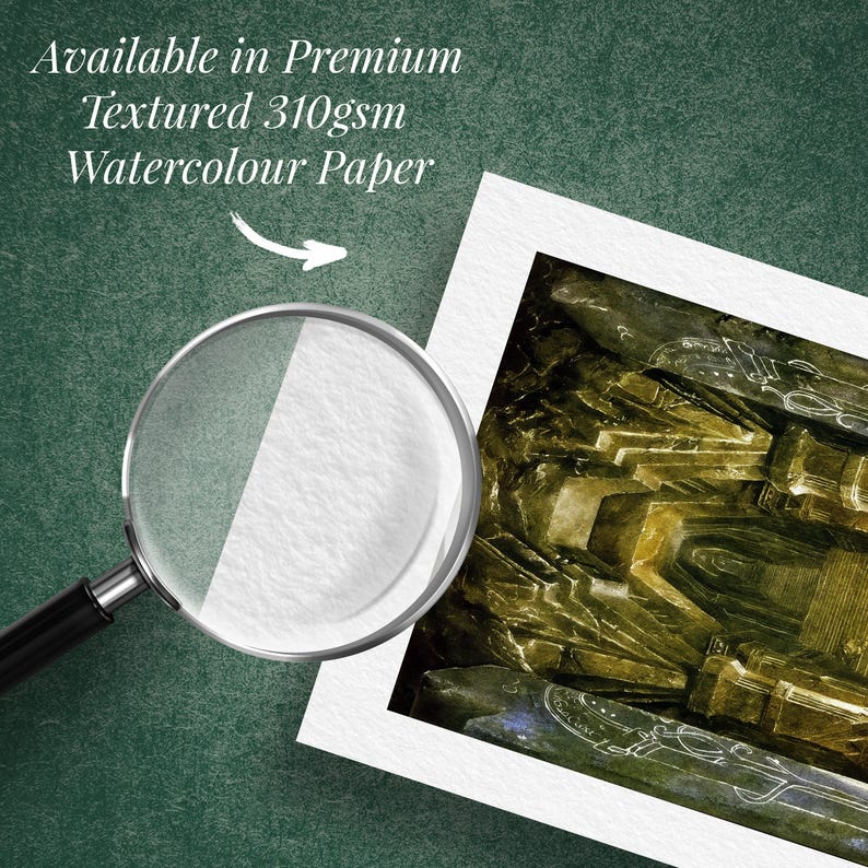 May include: A magnifying glass focuses on a watercolour print on textured paper. The print displays a detailed, abstract design in green, brown, and gold tones. Text at the top reads "Available in Premium Textured 310gsm Watercolour Paper."