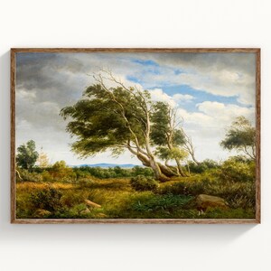 May include: A framed landscape painting shows a windswept scene with trees, a field, and a cloudy sky. The artwork has a wooden frame and a natural colour palette of greens, browns, and blues.