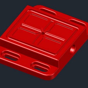 May include: A vibrant red, rectangular component with a recessed top featuring a cross-shaped design and four rectangular indentations. The component has two elongated holes and a circular hole on the side. The object is made of a solid material.
